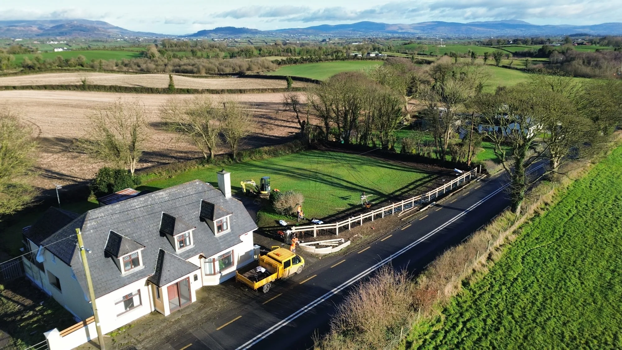 Aerial view of property with maintained hedges